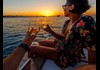 Relax on board with snacks, beer, and wine